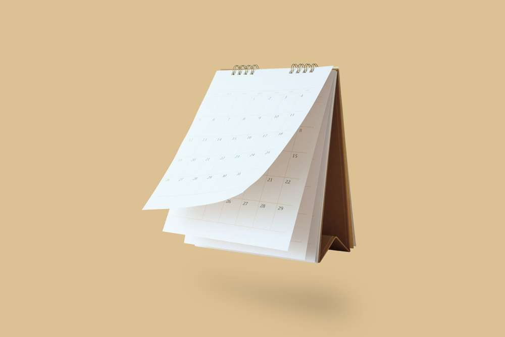 white desk calendar flipping through months